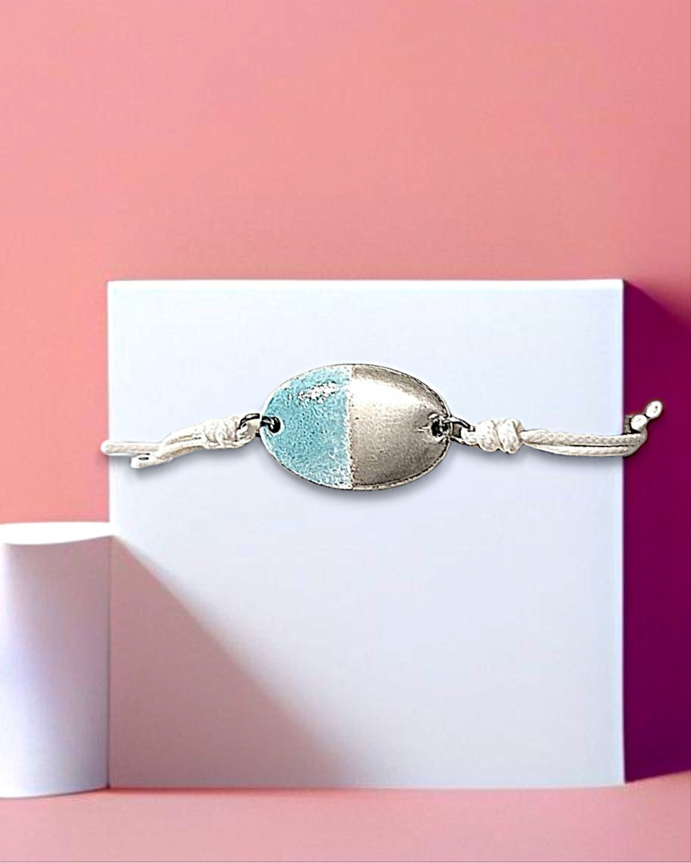 bracelet bleu ciel en émail sur cuivre et lustre d'argent mont" sur un cordon blanc chez maison CALUB